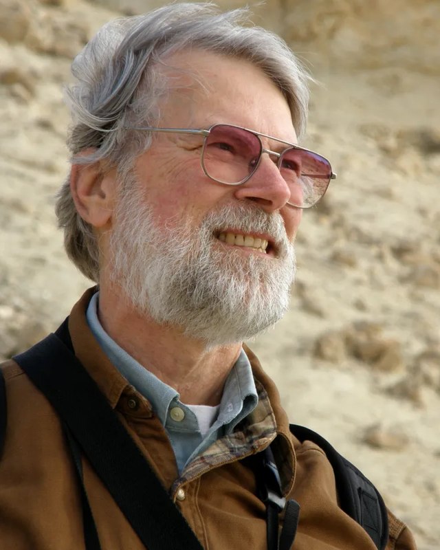Alan Templeton outdoors at a fossil site.